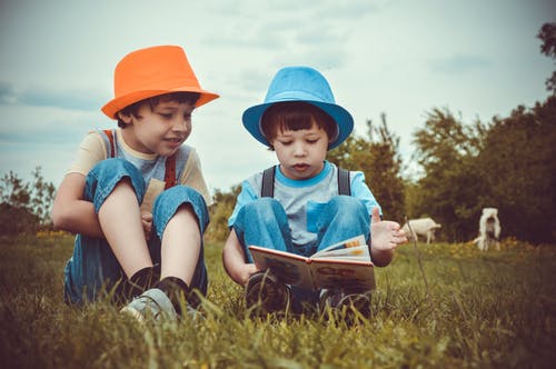 Two young boys reading