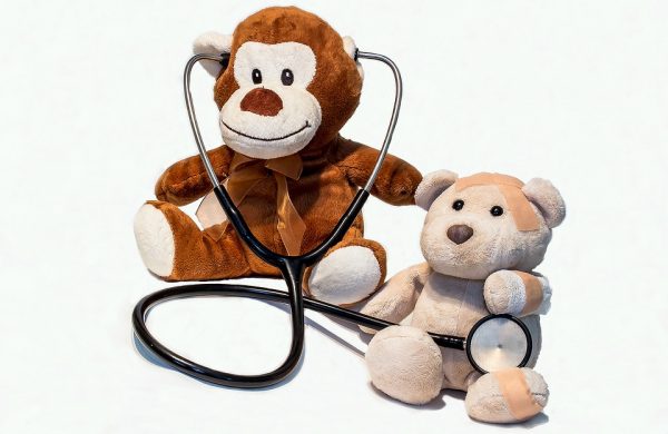 Two teddy bears acting as a doctor and patient