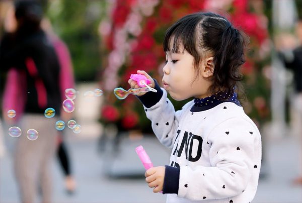 Girl blowing bubbles