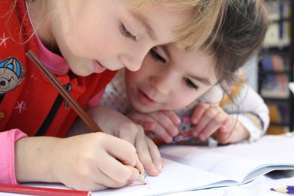 Two girls drawing