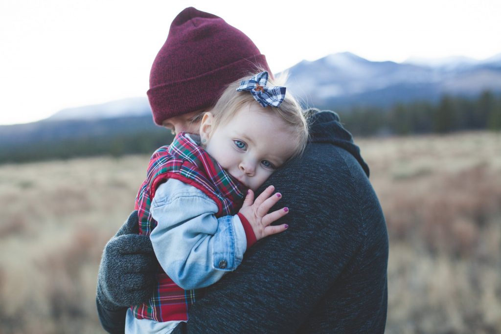 a father hugging his daughter