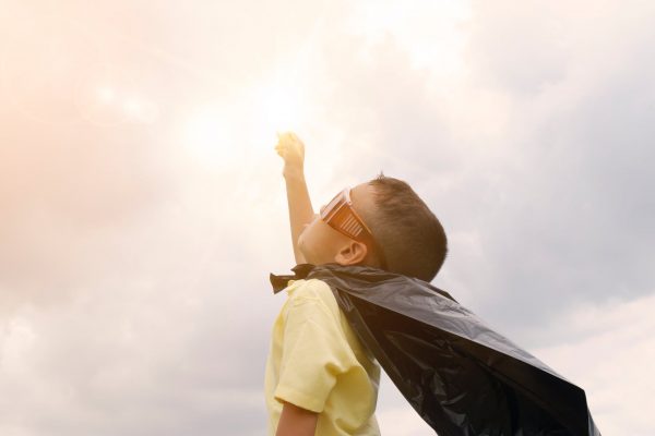 A boy dressed as a superhero