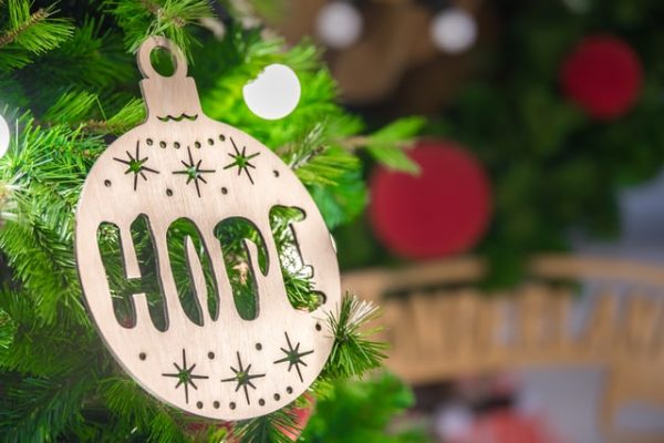 a christmas ornament saying hope to represent how to be happy this christmas