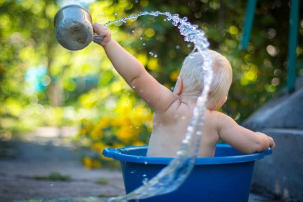 baby in a bucket of water