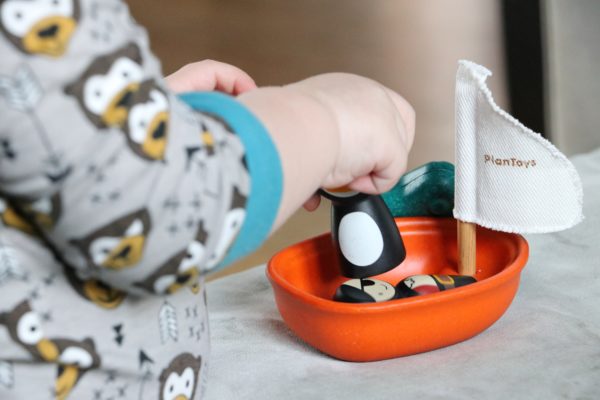 a toy boat to represent learning at home