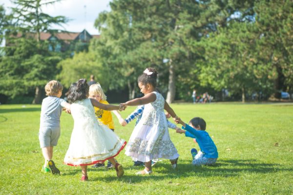 outside play to represent how to teach your child kindness