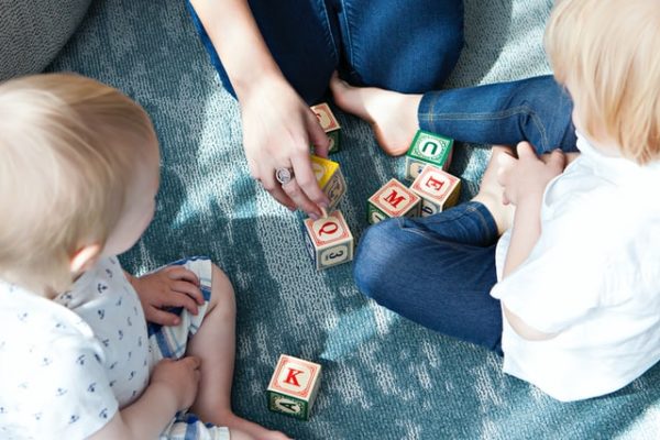 Children playing with building blocks to represent Why Join a Schoolhouse Day Nursery