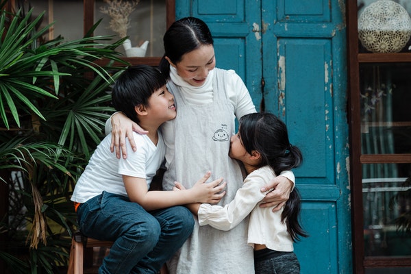 Mother and children talking to represent preparing your child for starting school