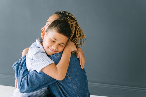 mother and son hugging to represent back-to-school anxiety